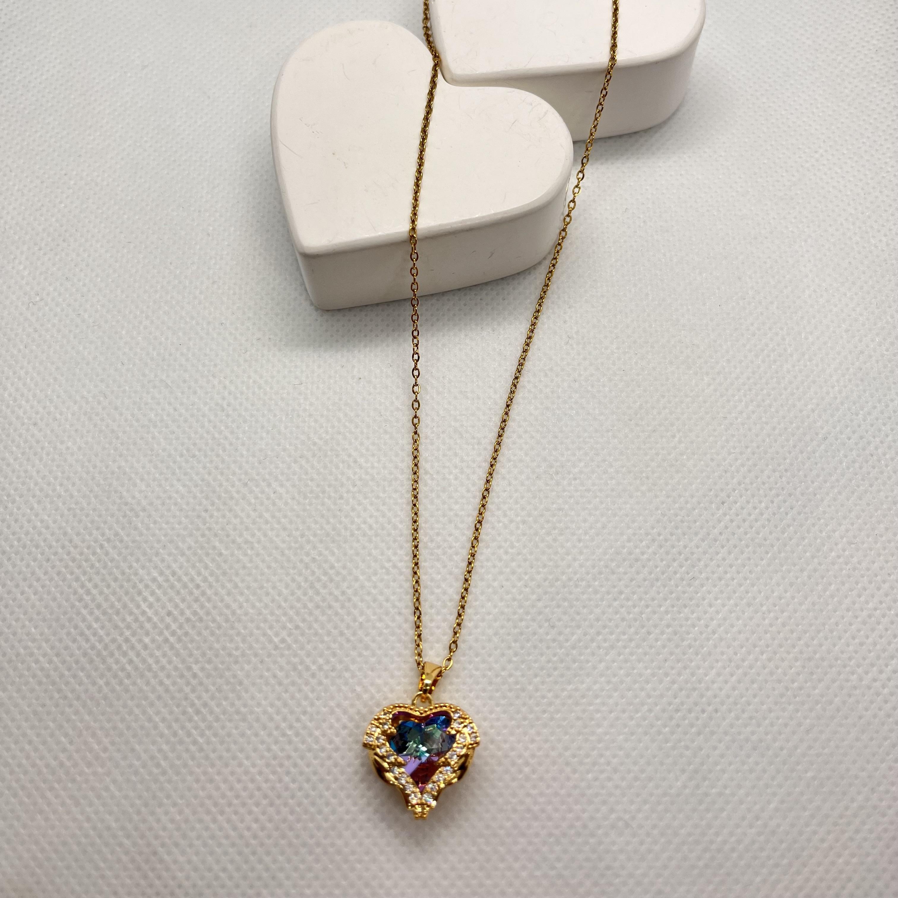 İçi yaner döner taşlı kafes kalp çelik kolye